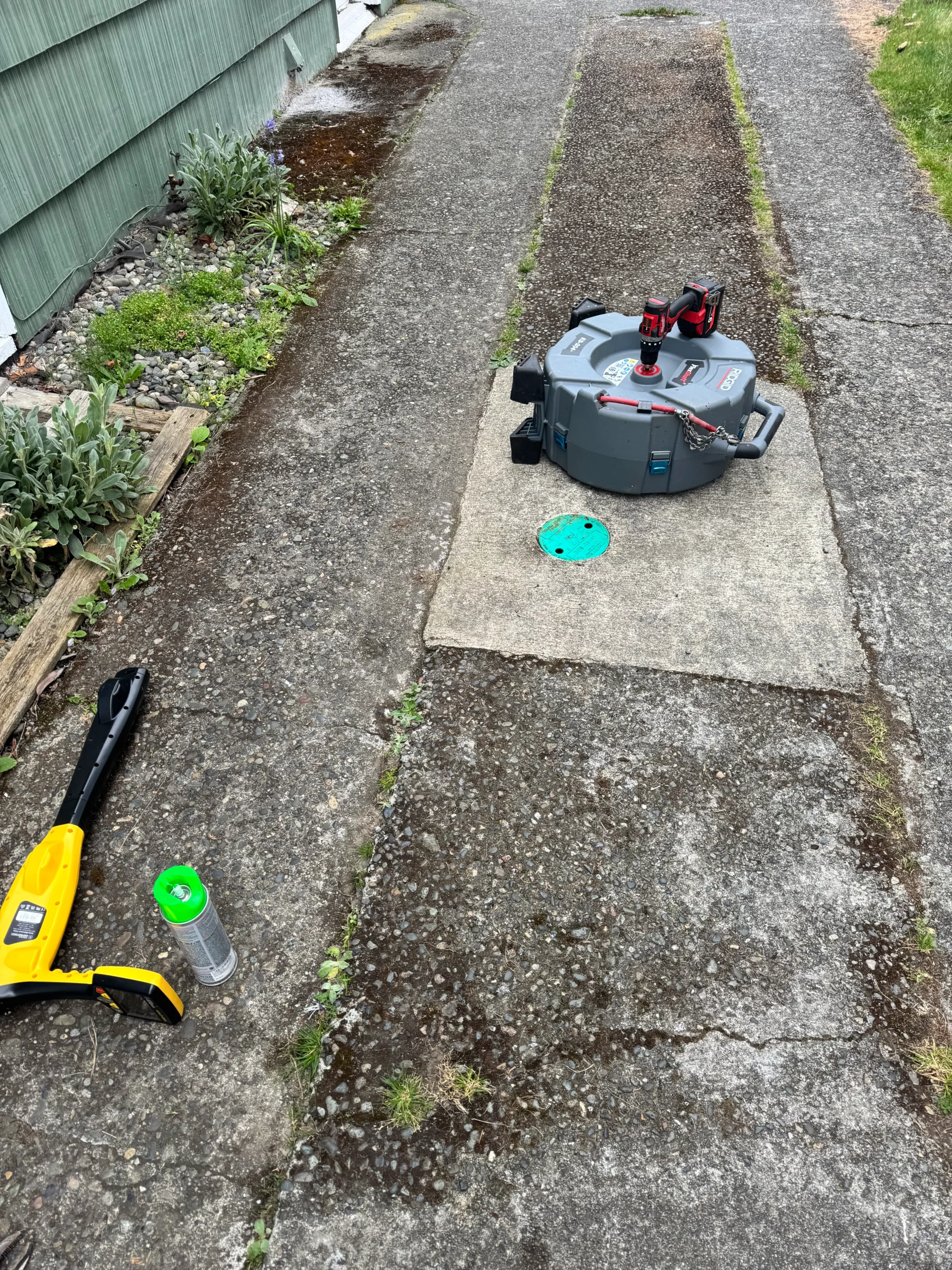 Clogged drain cleaning in Seattle WA — technician unclogs severely backed-up drain with camera inspection and rooter service