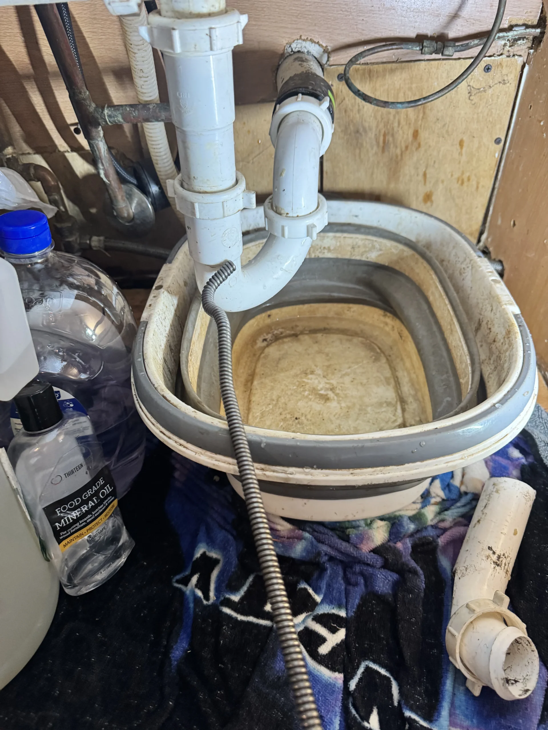 Buildup cleared from a Ballard drain line during main drain cleaning