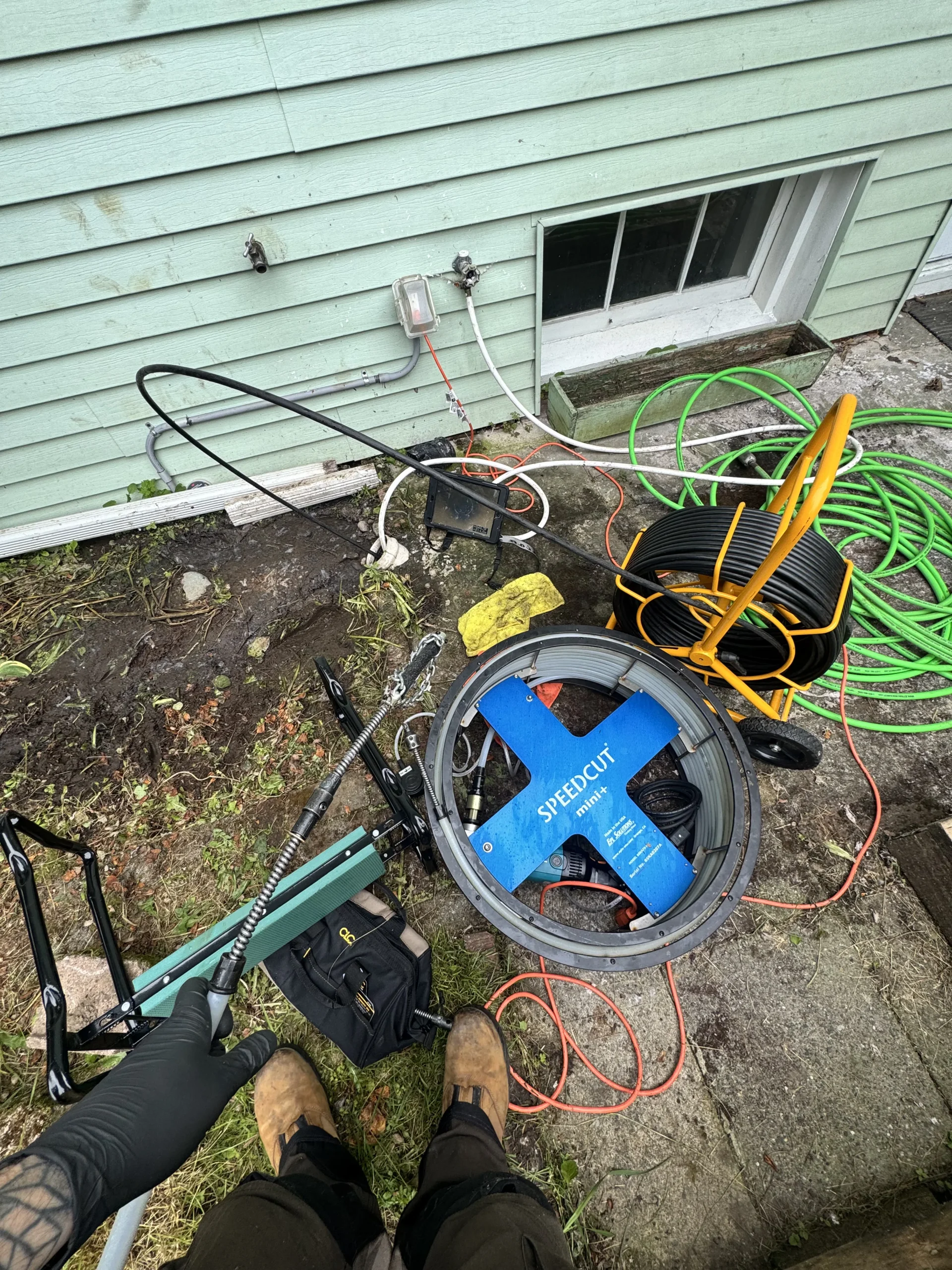 Descaling equipment set up at a Lake Forest Park exterior cleanout for pipe descaling