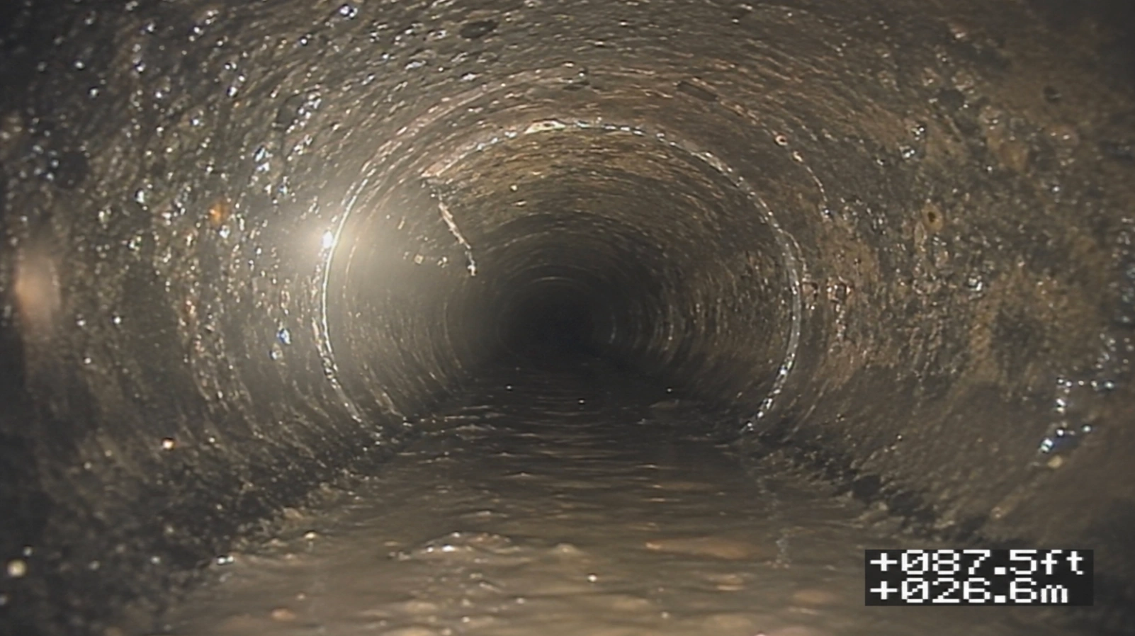 The same Seattle sewer line after root removal and cleaning, showing a clear pipe interior