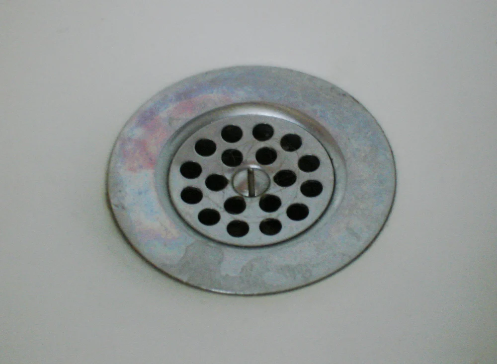 Close view of a chrome bathtub drain strainer